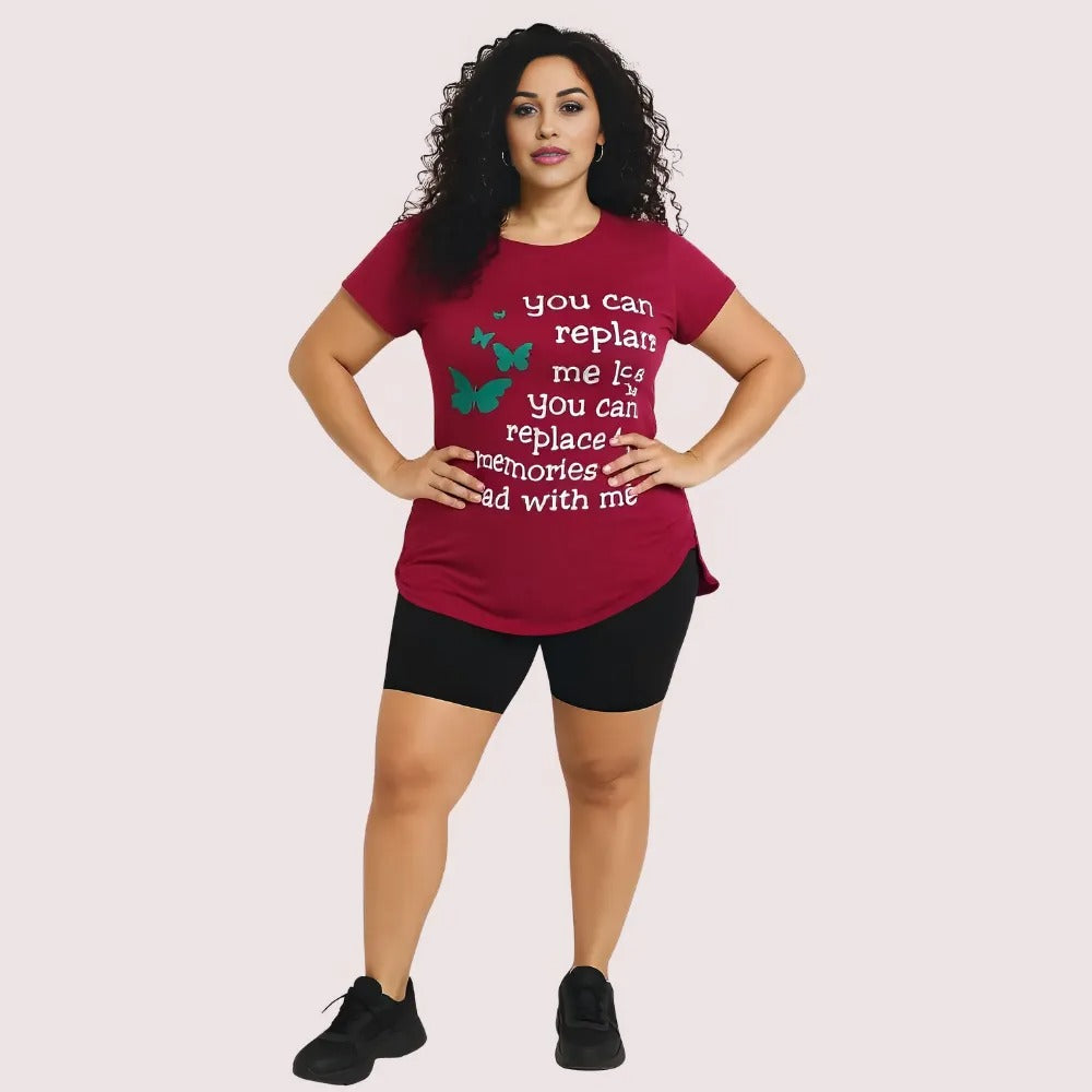 Woman wearing a red t-shirt with text and graphics on a plain background